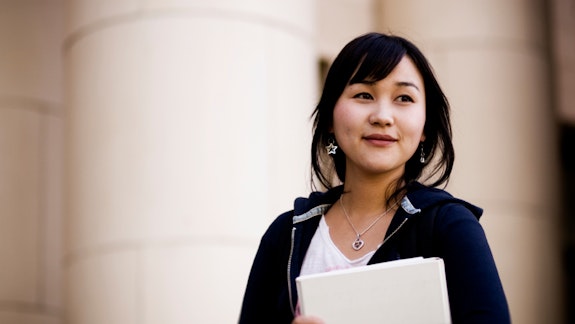 Law student in front of columns