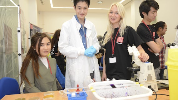 Photo of sixth formers at interactive demo at STEM conference