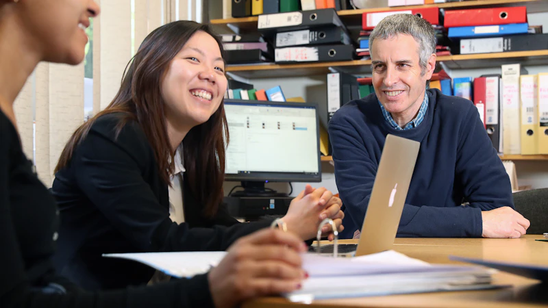 Law staff and students engaged in discussion