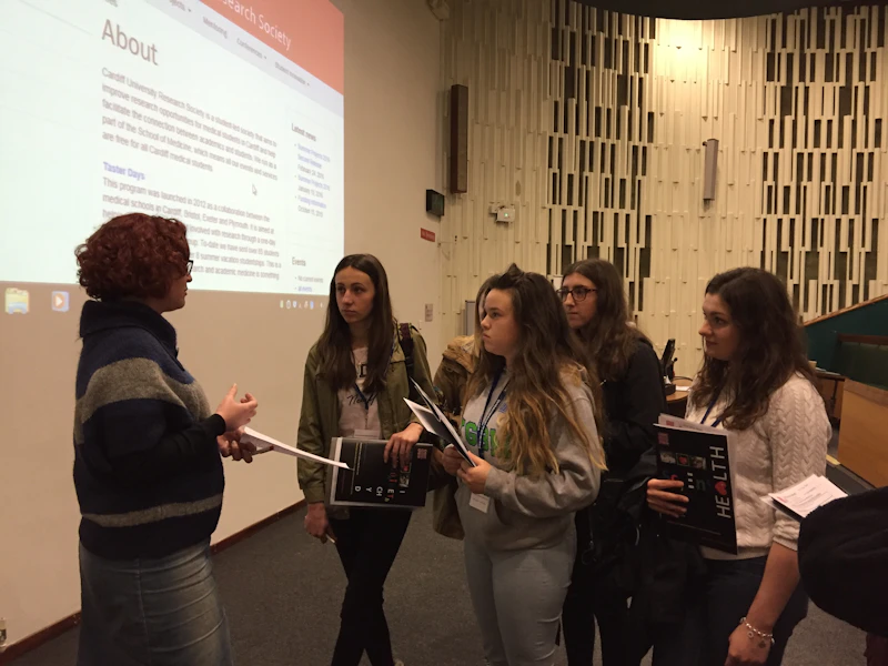 Photograph of young people speaking to CNGG researcher