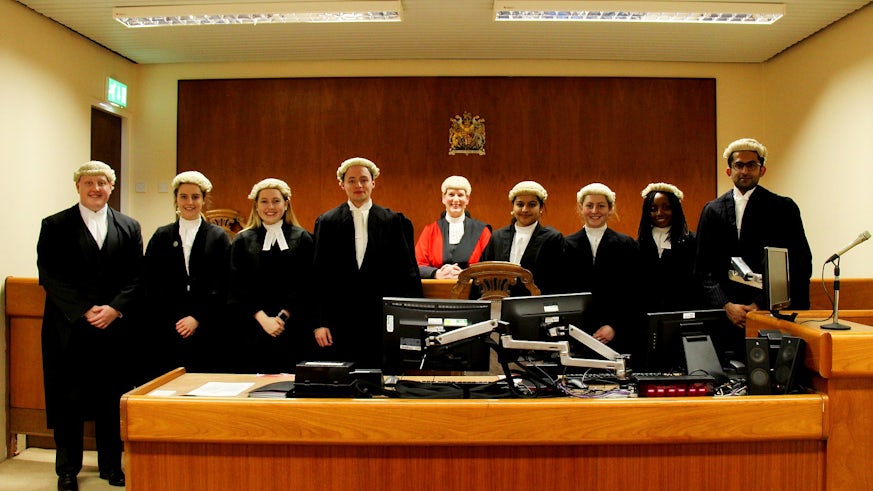 The mock trial finalists with The Recorder of Cardiff, HHJ Tracey Lloyd-Clarke, acting as Judge. Photo by Jonathan Marsh.