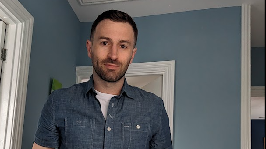 A man posing for a photo