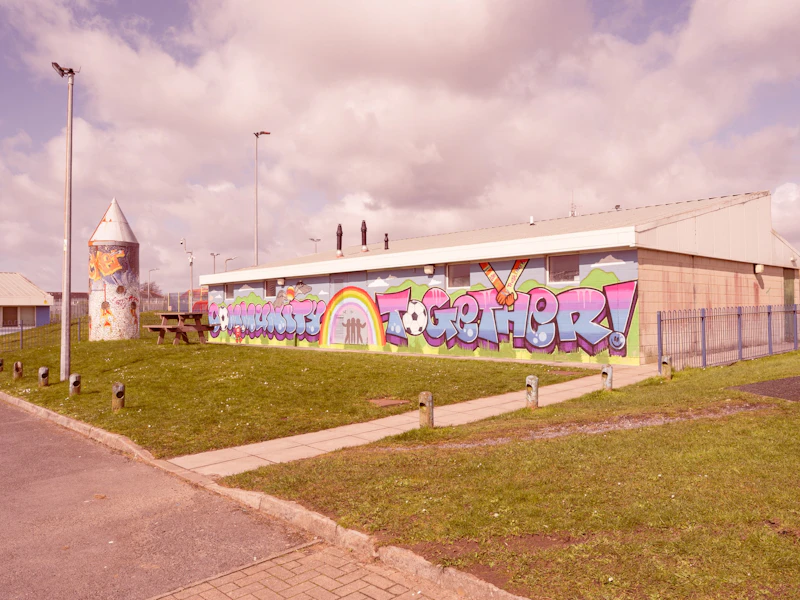 A wide shot of the exterior of a community centre building
