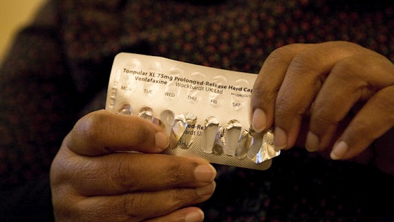 A patient holding medication.