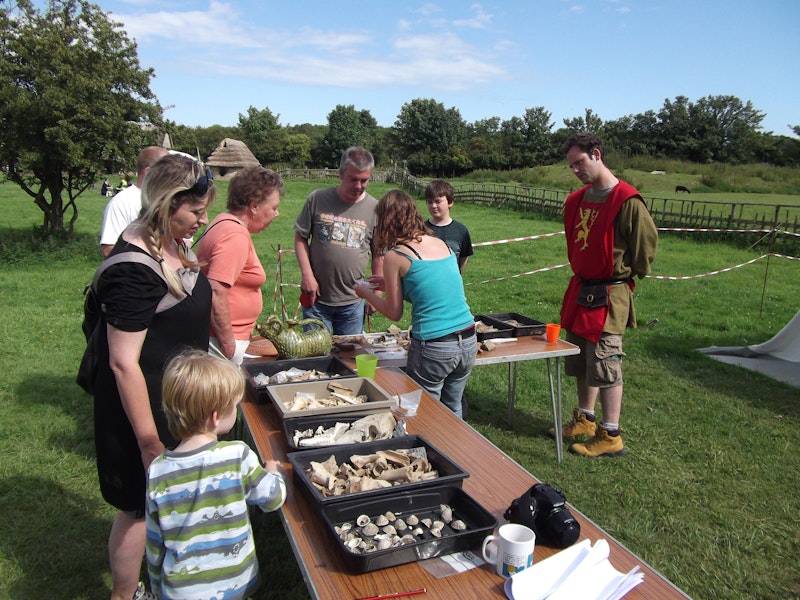 Visitors looking at finds