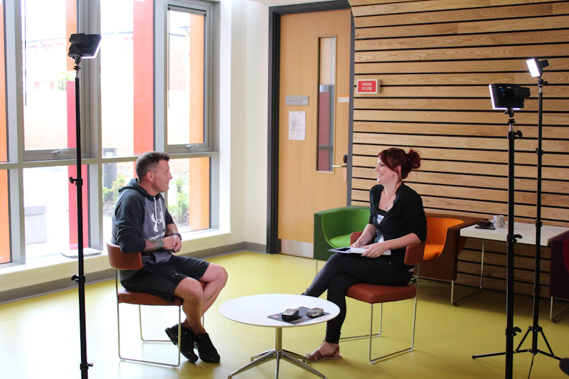 Photograph of Neilson and Hannah being interviewed