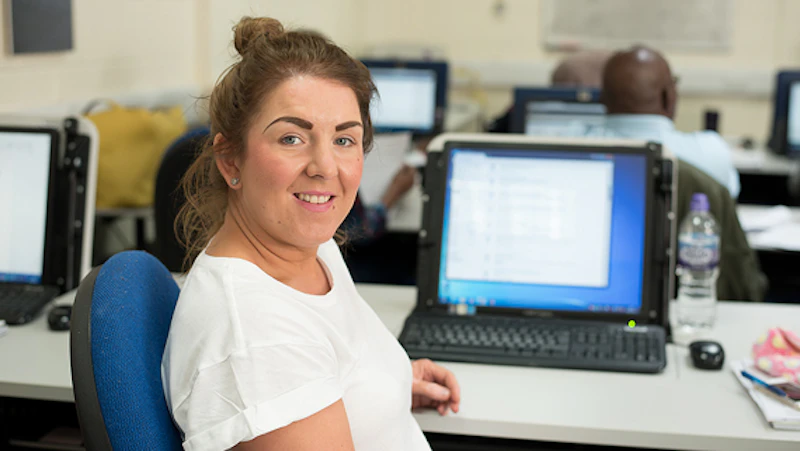Female student in front of a computer