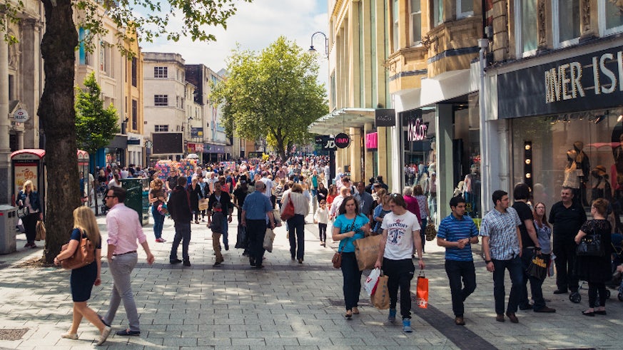 Image of a busy high street filled with shoppers