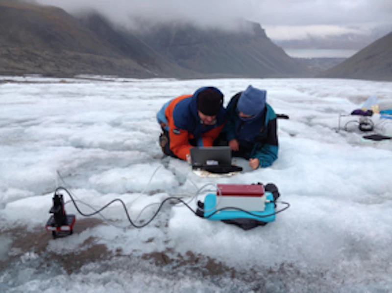 Researchers assessing the photophysiology of cryoconite in Svalbard.