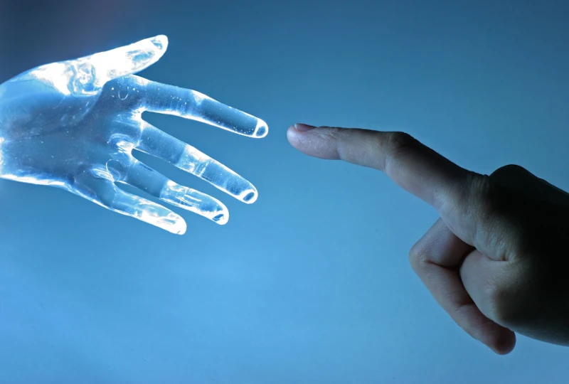 Cyborg hand and human hand