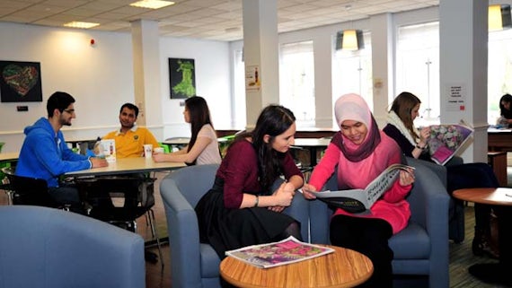 Students enjoying the social space in the Redwood Building