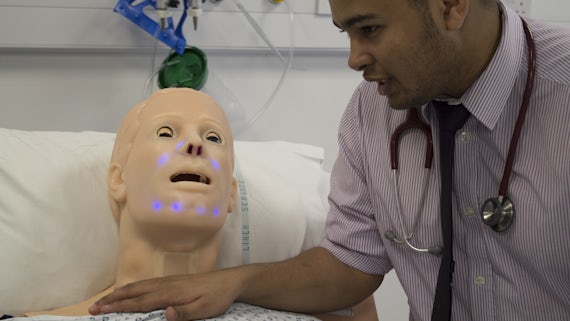 A student from the School of Medicine in a simulation suite