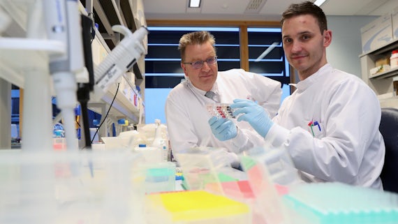 Professor Andrew Sewell with Research Fellow Garry Dolton in a lab