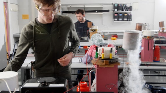 A student works in the Physics lab on a project