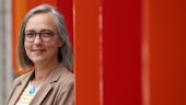 Professor Claire Gorrara against a red background