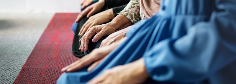 A number of people kneeling