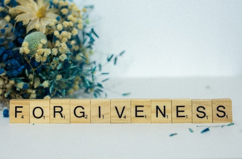 FORGIVENESS spelt on scrabble tiles