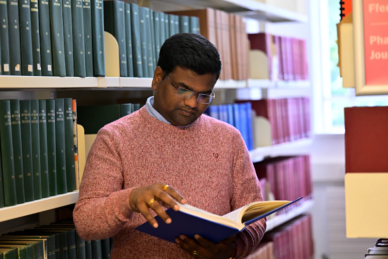 A student reading in the Library