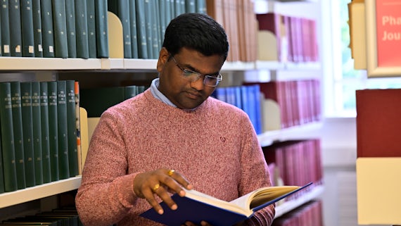 A student reading in the Library