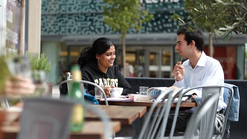 Man and woman chatting in cafe