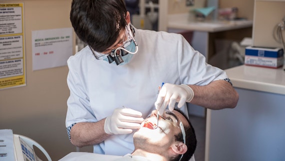Fourth year Dentistry student checking teeth