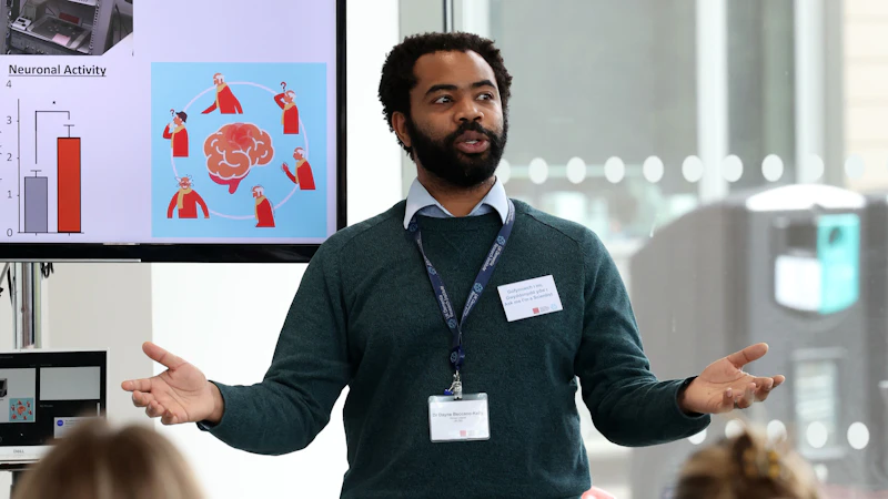 An image showing a scientist giving a talk