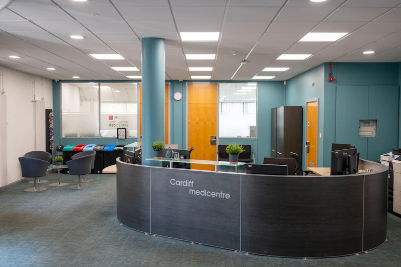 The reception desk and seating area in Medicentre