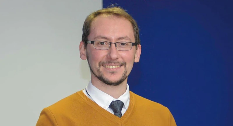 Head shot of man smiling at camera