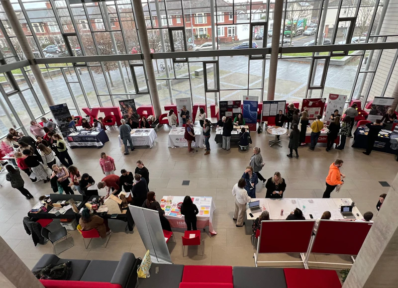 A bird's eye view of the Hadyn Ellis building foyer busy with visitors.