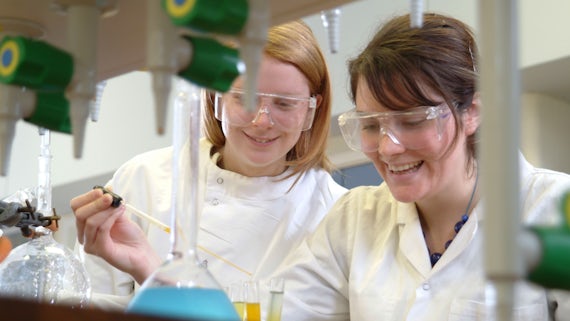 Female chemistry students in a lab