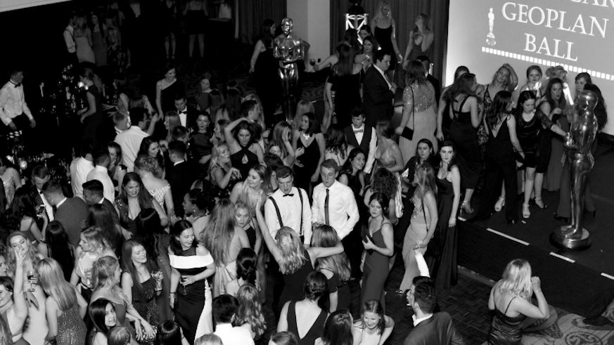 Black and white overhead image of multiple people on the dancefloor