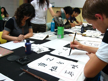 Students learn calligraphy by copying Chinese characters