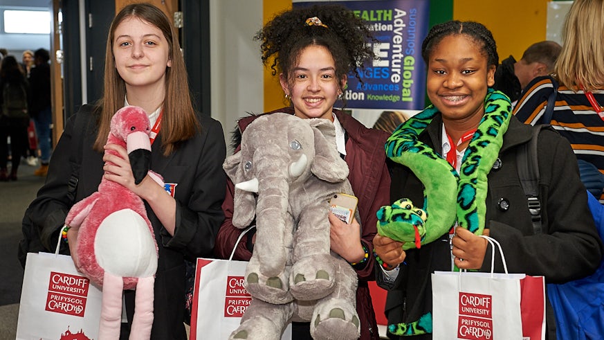 Students with cuddly toys