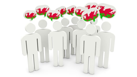 Stick figures with Welsh flag