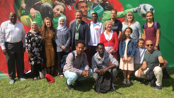 Michael Sheen with refugees from summer school
