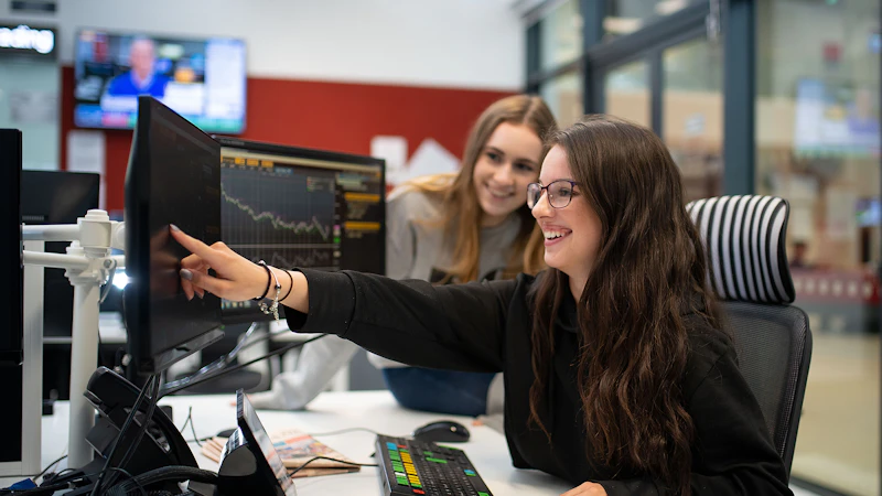 Students looking at computers