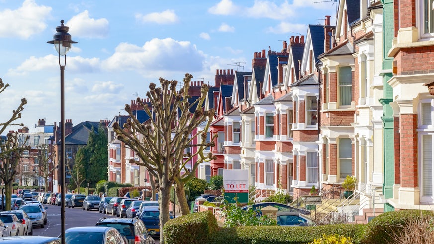 Row of typical English terraced houses in West Hampstead, London with a To Let sign outside stock image