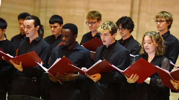 A number of students taking part in a choir performance