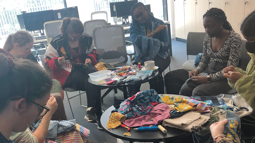A group of student sewing at the Remakerspace