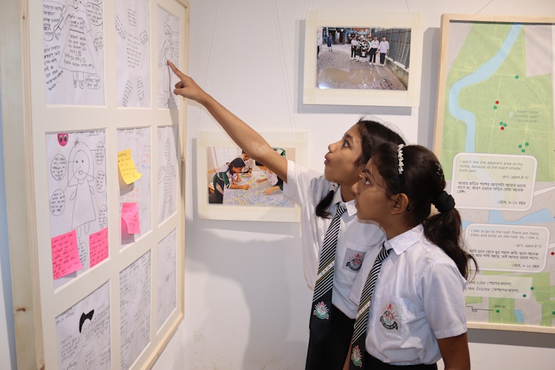 Two children look at exhibits.