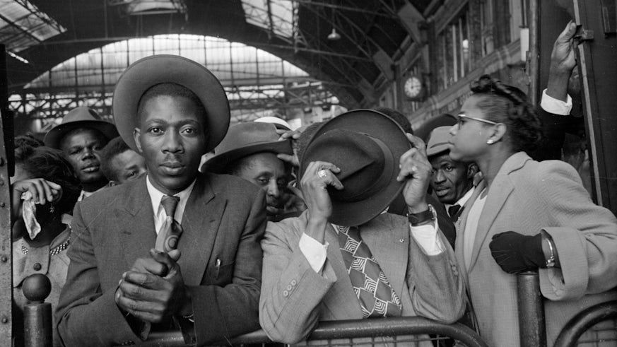 black and white picture of people in a train station
