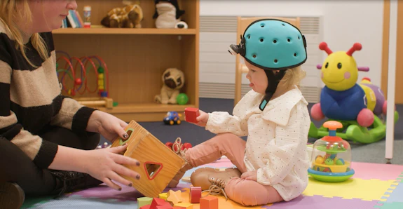 Baby wearing a headcam playing with blocks
