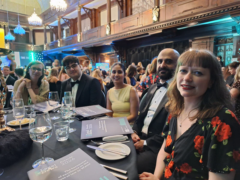 Group shot of people sitting around a table 
