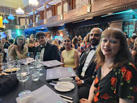Group shot of people sitting around a table 
