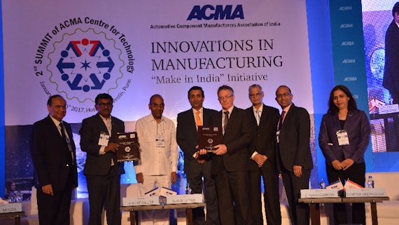 Image of Professor Peter Wells and Dr Maneesh Kumar, with other panel members, at the ACMA event in Pune, India