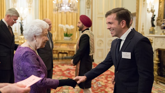 Reader in Asian Religions Dr James Hegarty meeting HM The Queen