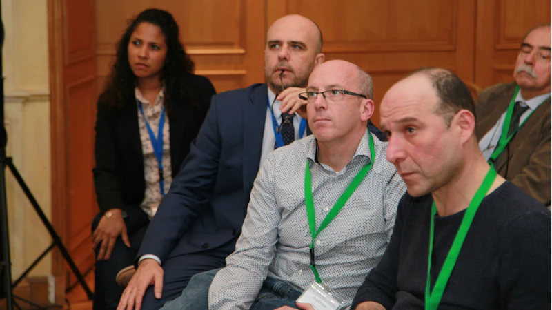 The audience listens intently to Mike Wilson's keynote address