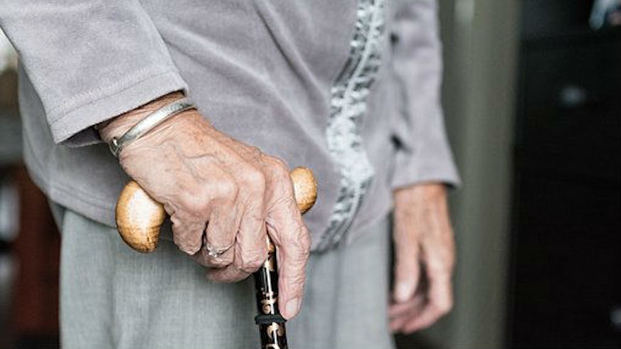 Patient with walking stick