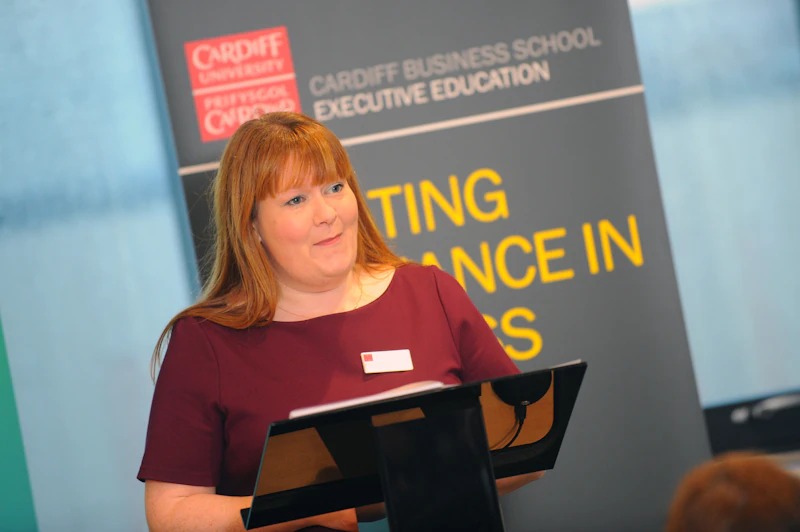 Woman presenting at podium