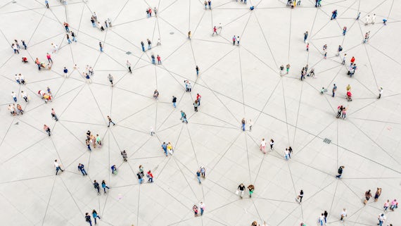 Aerial view of crowd connected by lines - stock photo